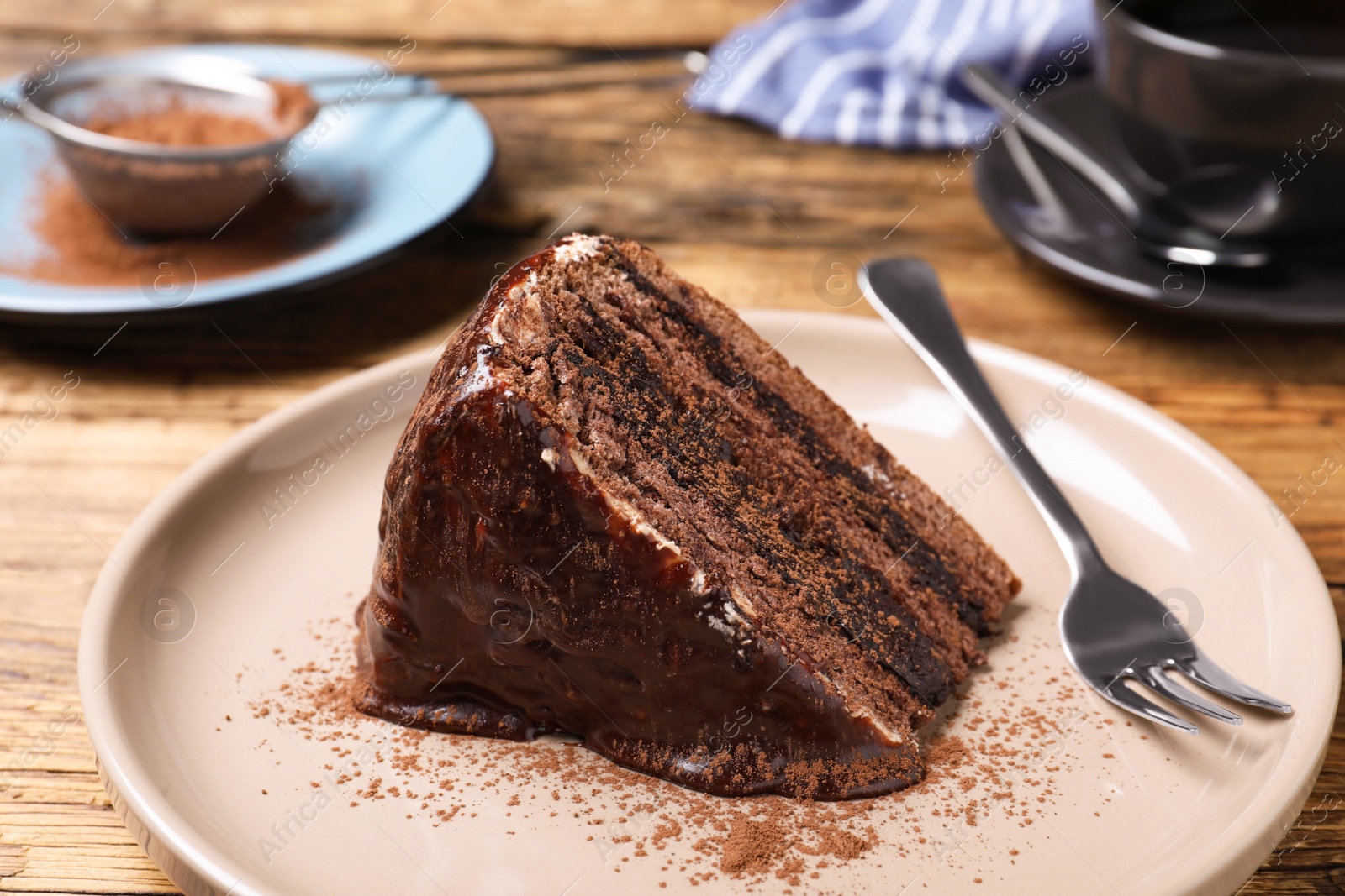 Photo of Delicious chocolate cake on wooden table, closeup