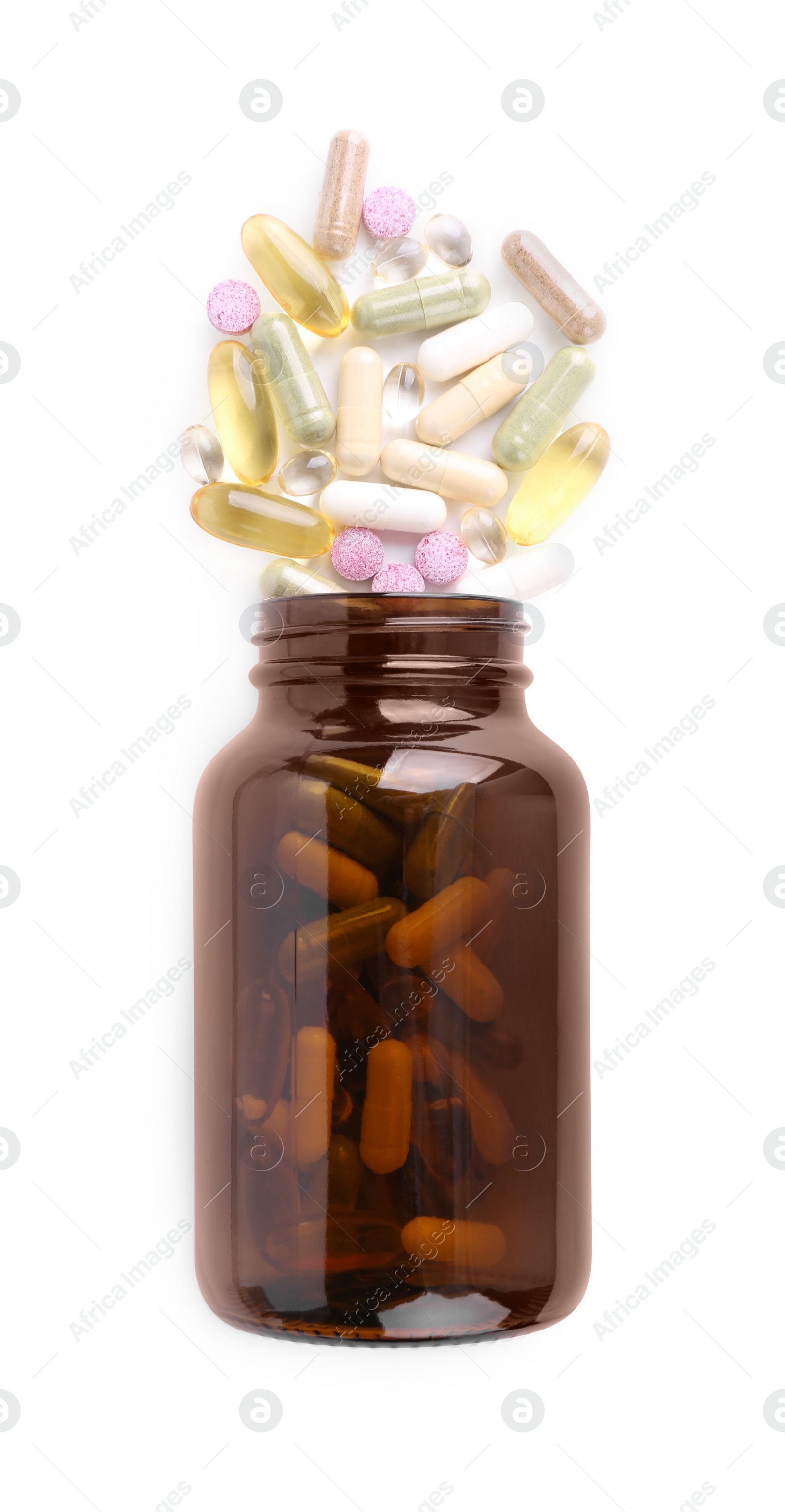 Photo of Bottle and different vitamin pills isolated on white, top view