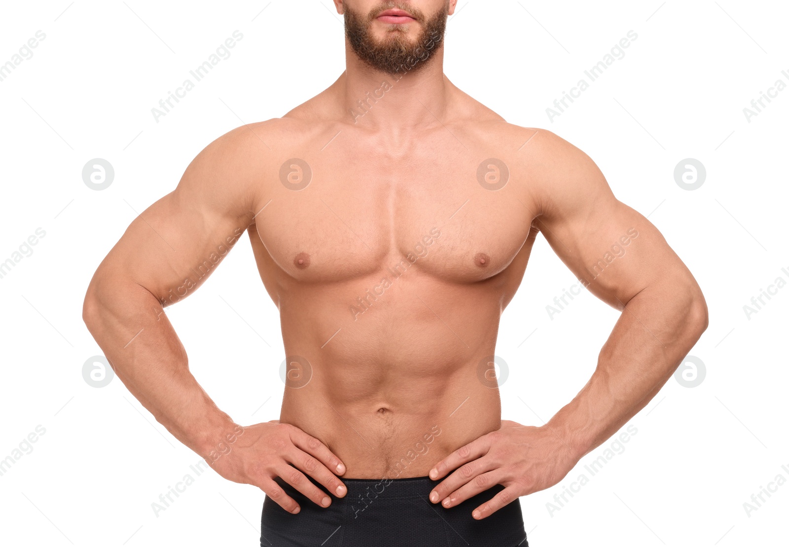 Photo of Muscular man showing abs isolated on white, closeup. Sexy body