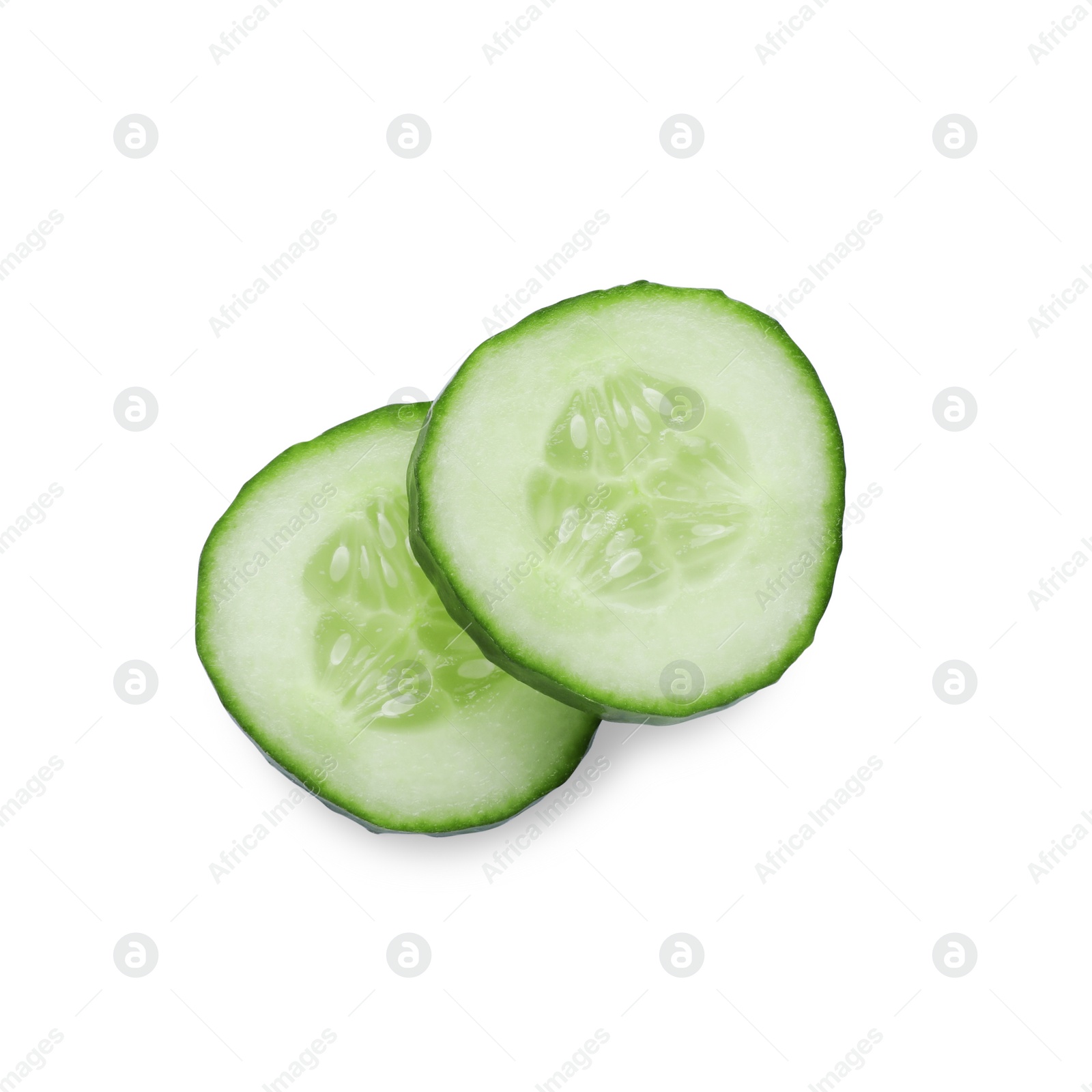 Photo of Slices of fresh green cucumber isolated on white, top view