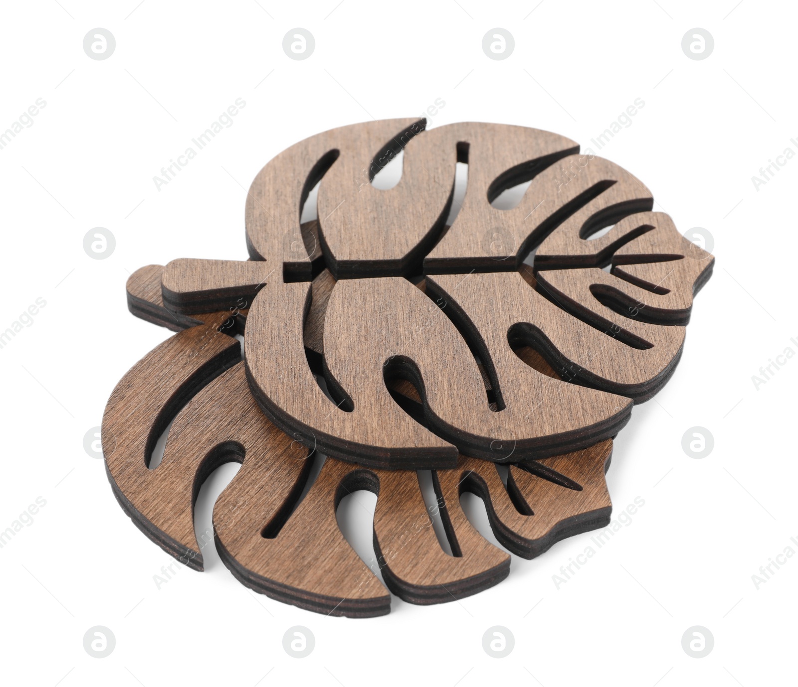 Photo of Leaf shaped wooden cup coasters on white background