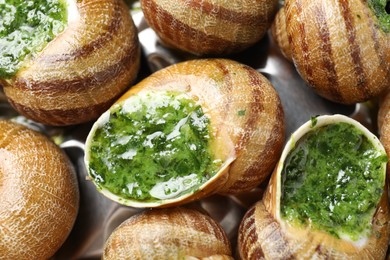 Delicious cooked snails on table, closeup view