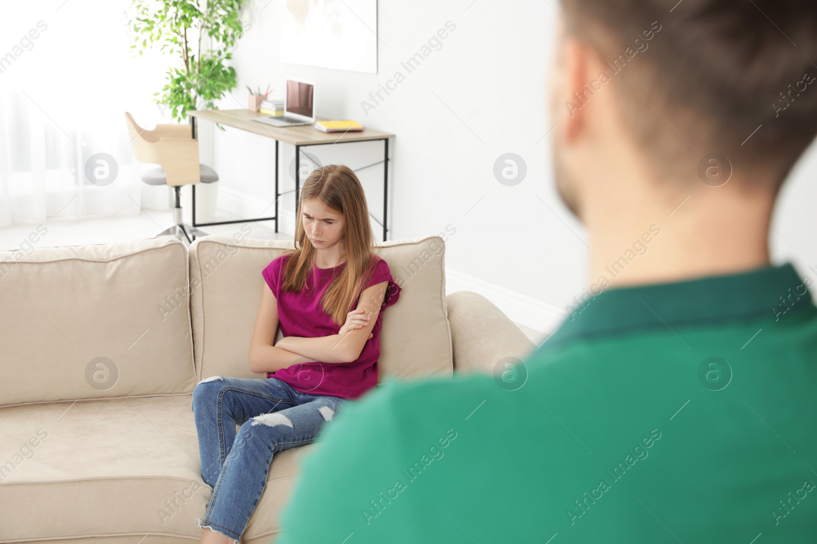 Photo of Father scolding his teenager daughter at home