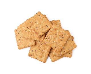Photo of Pile of cereal crackers with flax and sesame seeds isolated on white, top view