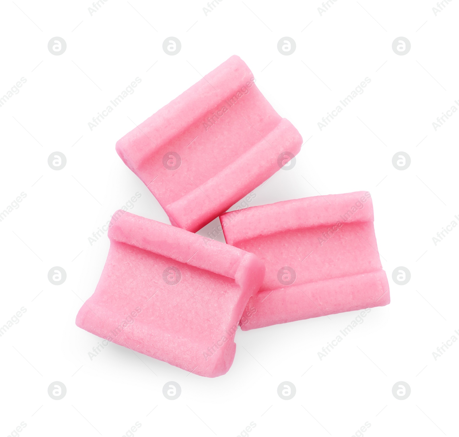 Photo of Tasty pink chewing gums on white background, top view