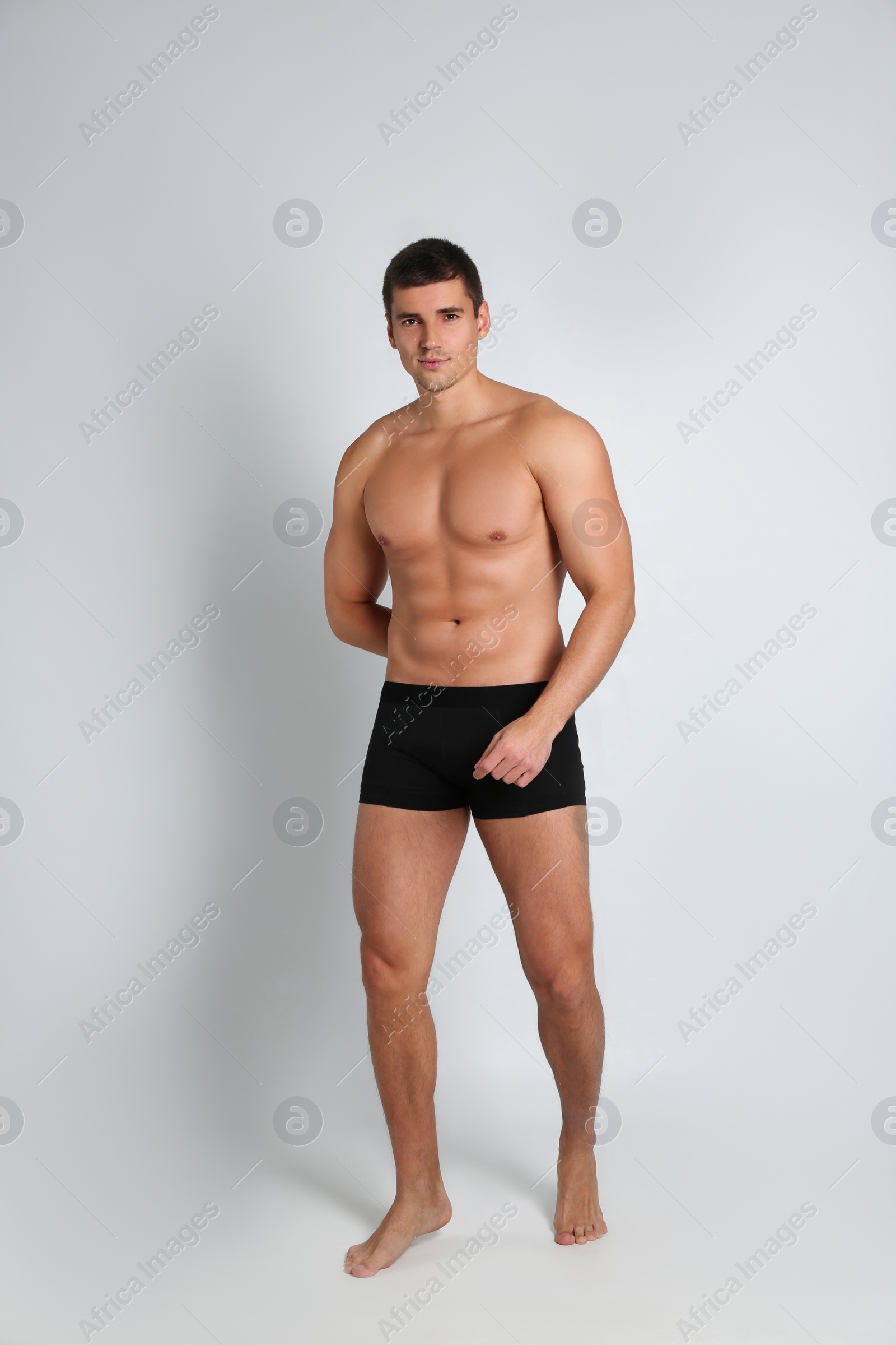 Photo of Man with sexy body on light background