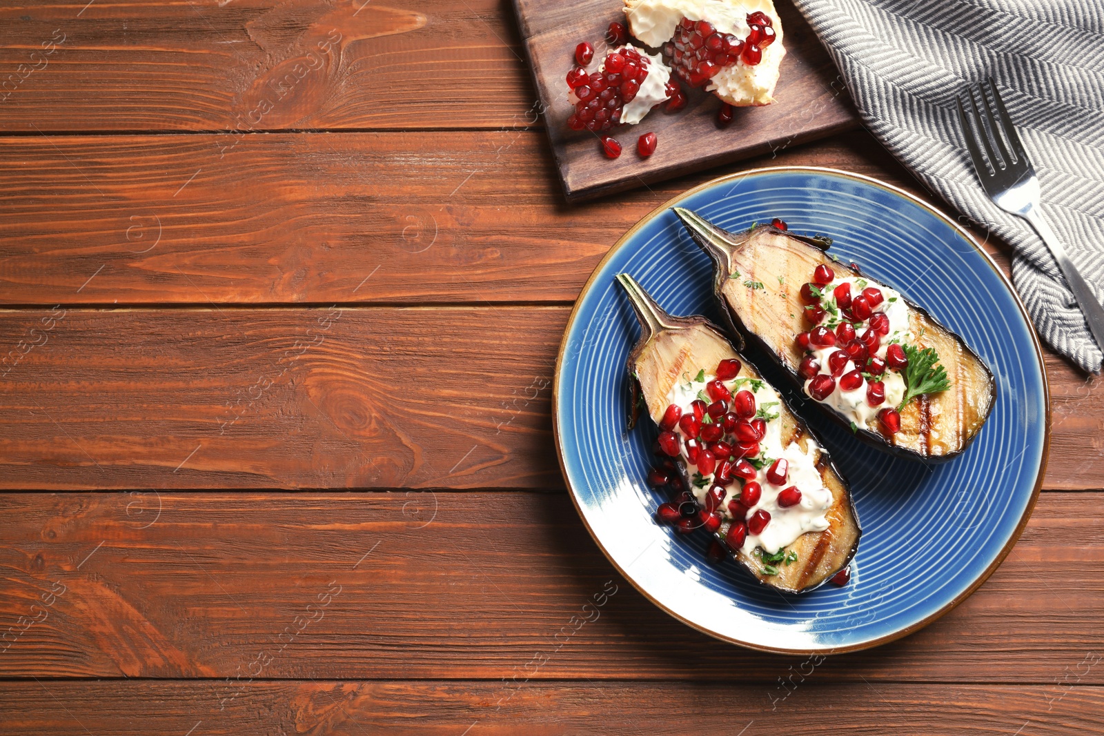 Photo of Flat lay composition with plate of fried eggplants and space for text on wooden table