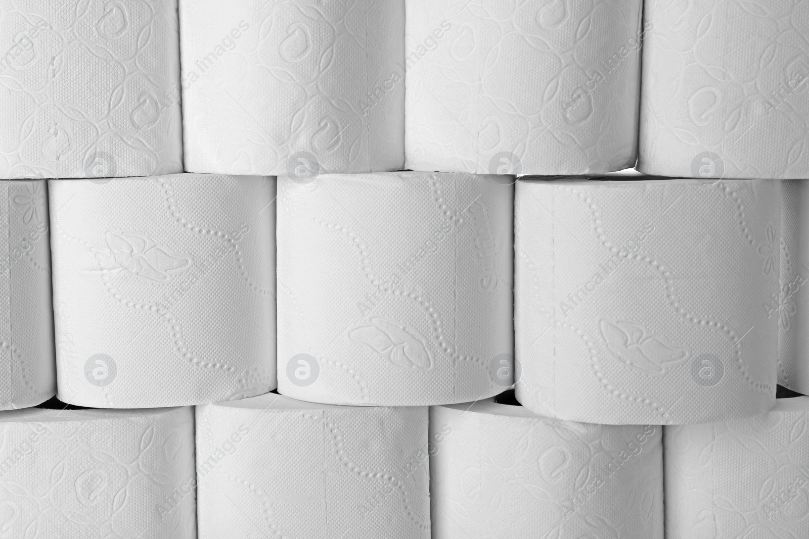 Photo of Many rolls of toilet paper as background. Personal hygiene