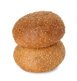 Photo of Two fresh hamburger buns with sesame seeds isolated on white