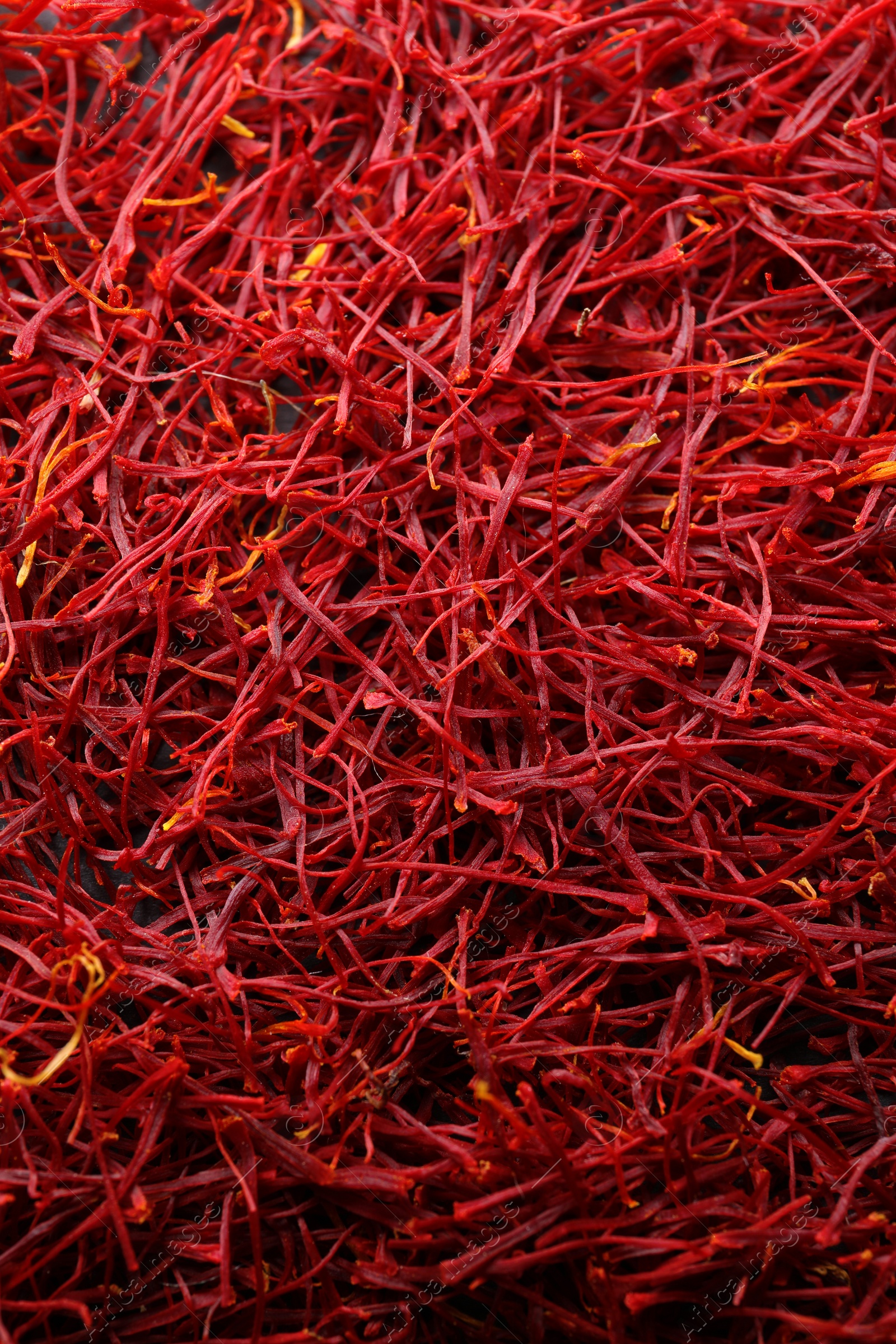 Photo of Red dried saffron as background, top view