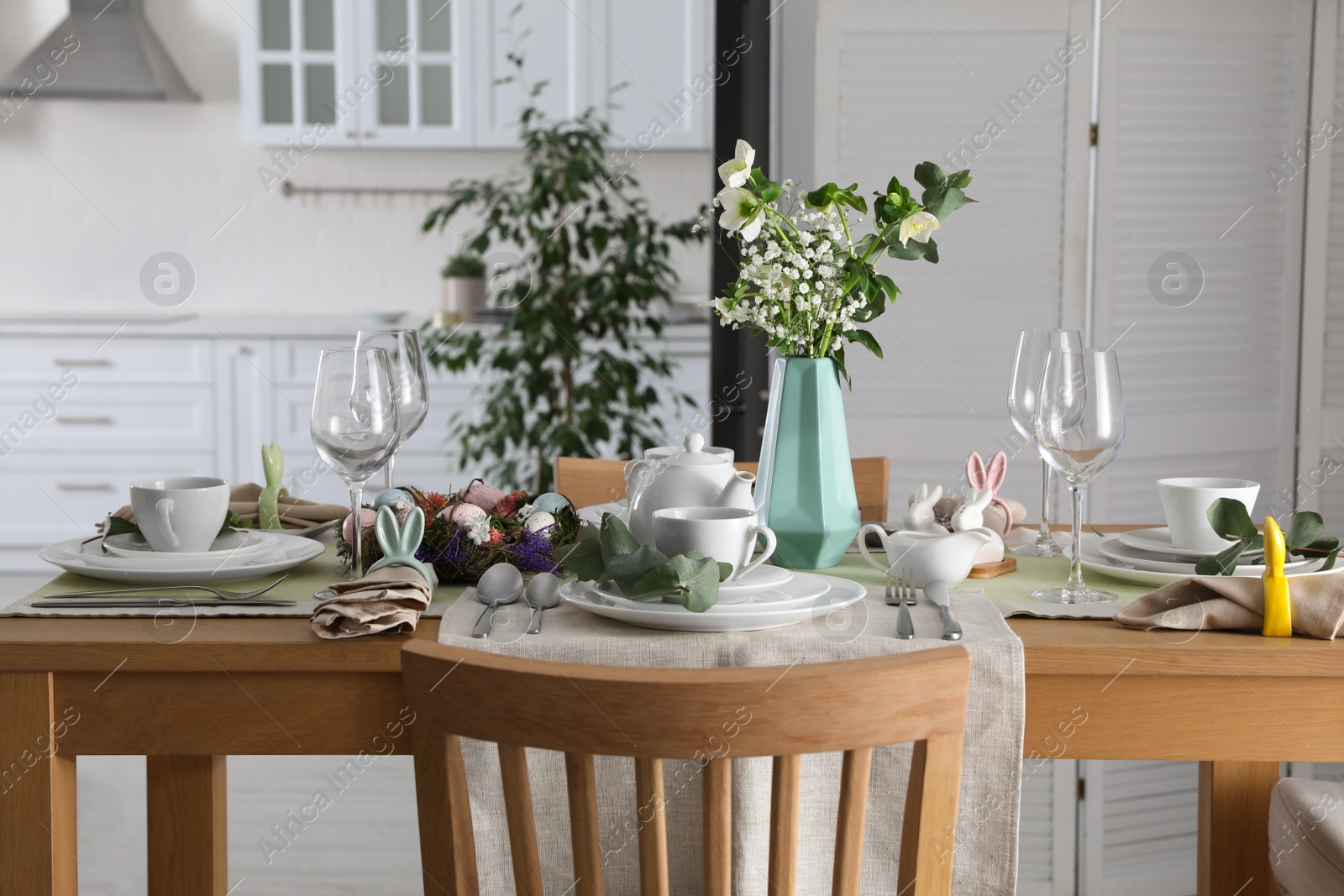 Photo of Beautiful Easter table setting with festive decor indoors