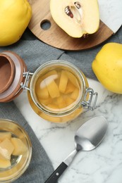 Delicious quince drink and fresh fruits on white marble table, flat lay