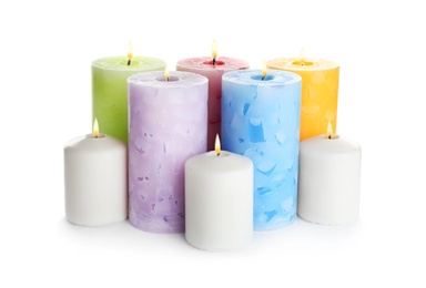 Photo of Set of different color candles on white background