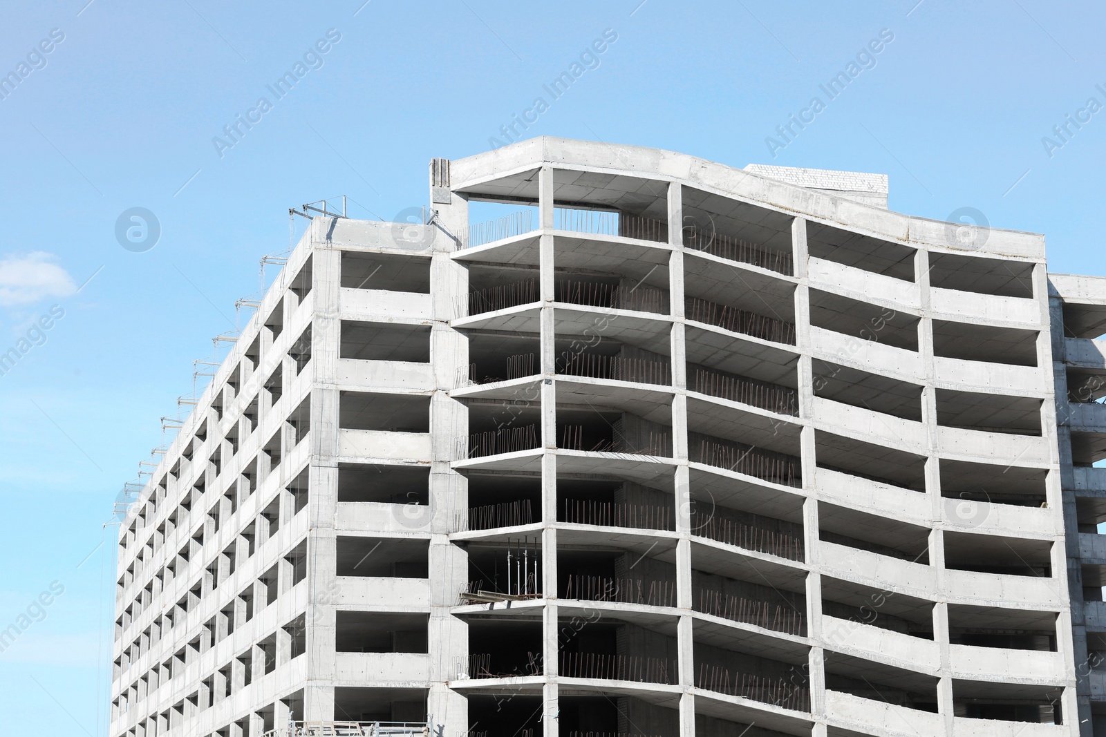 Photo of Construction site with unfinished building on sunny day