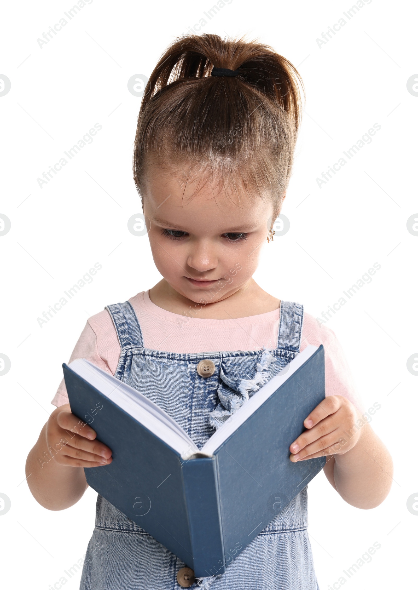 Photo of Cute little girl reading book on white background