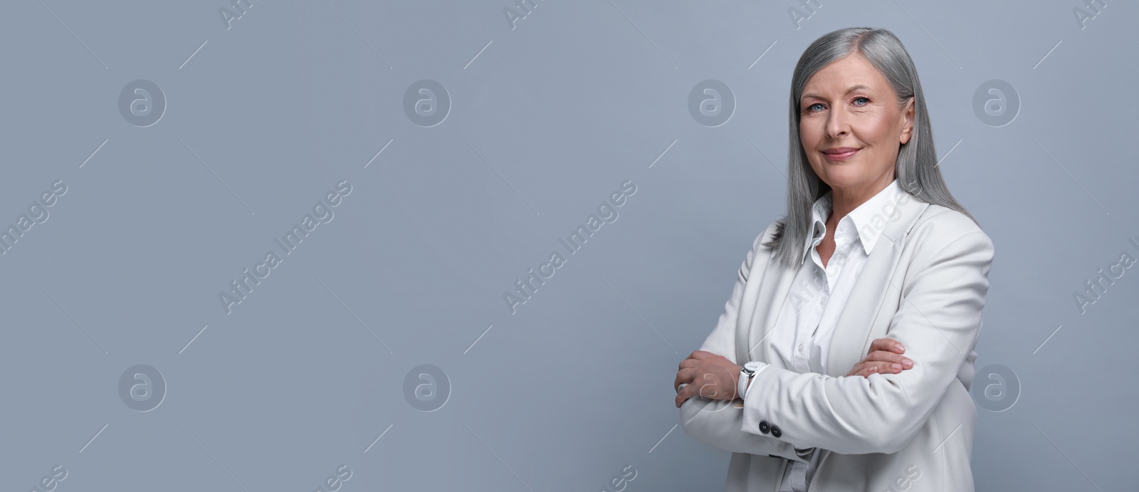 Image of Portrait of beautiful mature woman on light grey background. Banner design with space for text