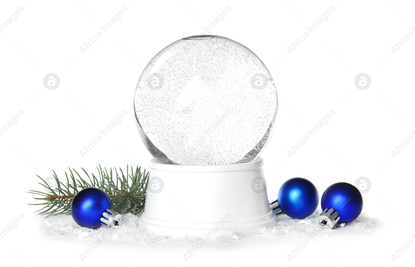 Photo of Magical empty snow globe with pine branch and Christmas balls on white background