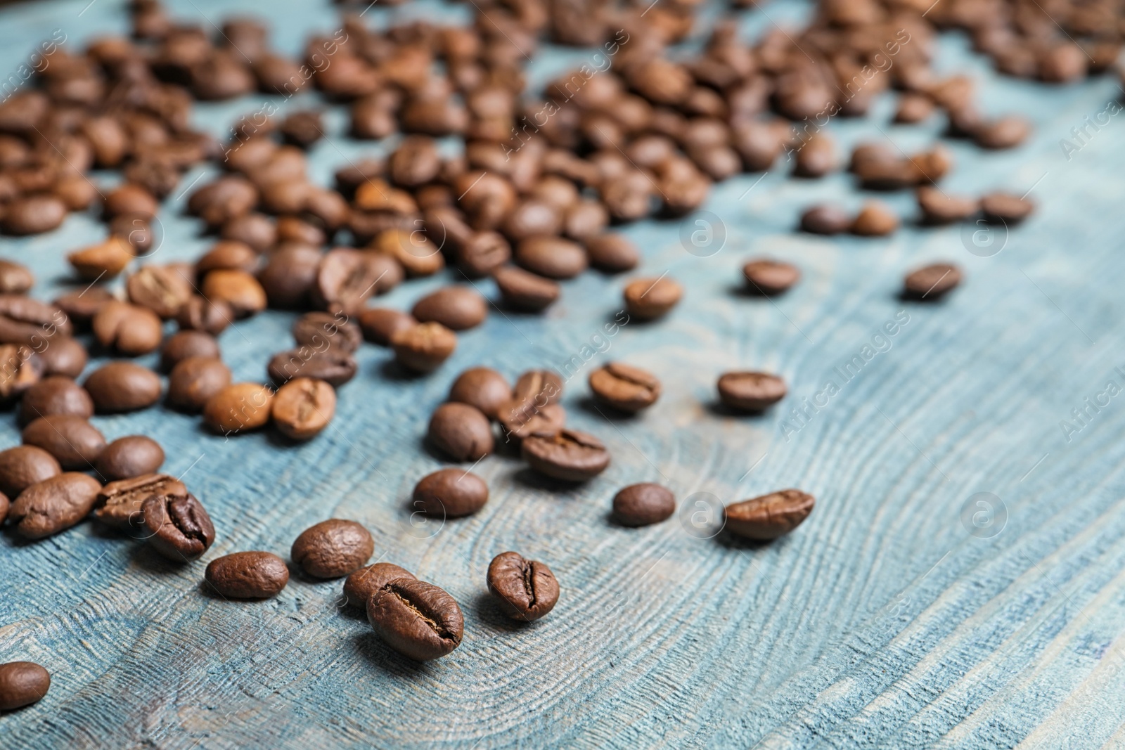 Photo of Coffee beans on wooden background