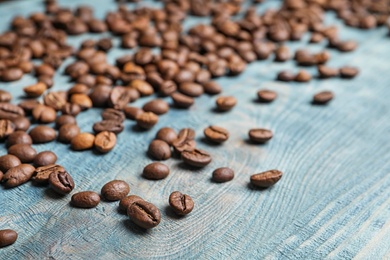 Photo of Coffee beans on wooden background