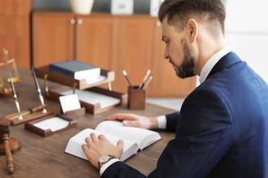 Male lawyer working in office