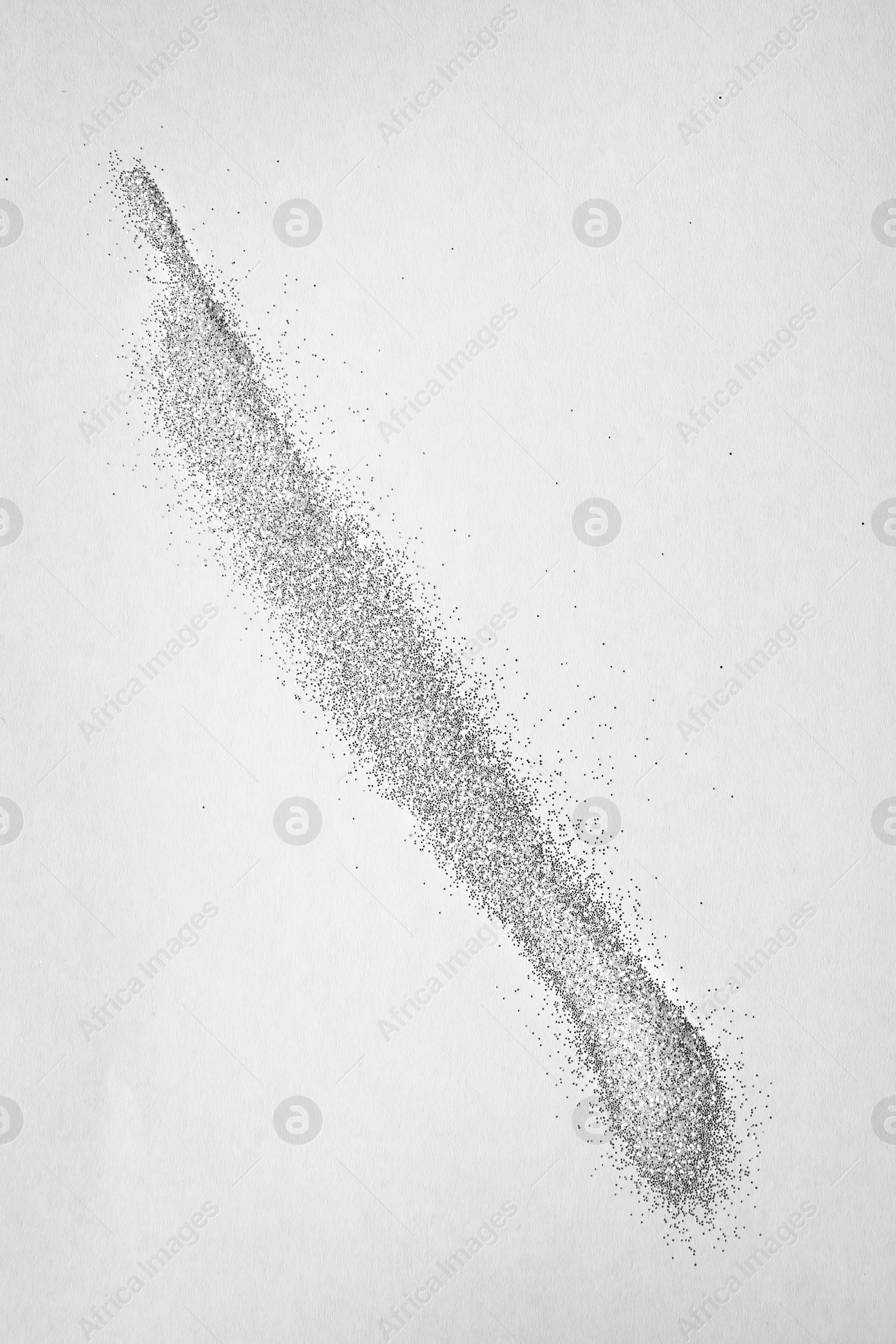 Photo of Line made of shiny silver glitter on white background, top view