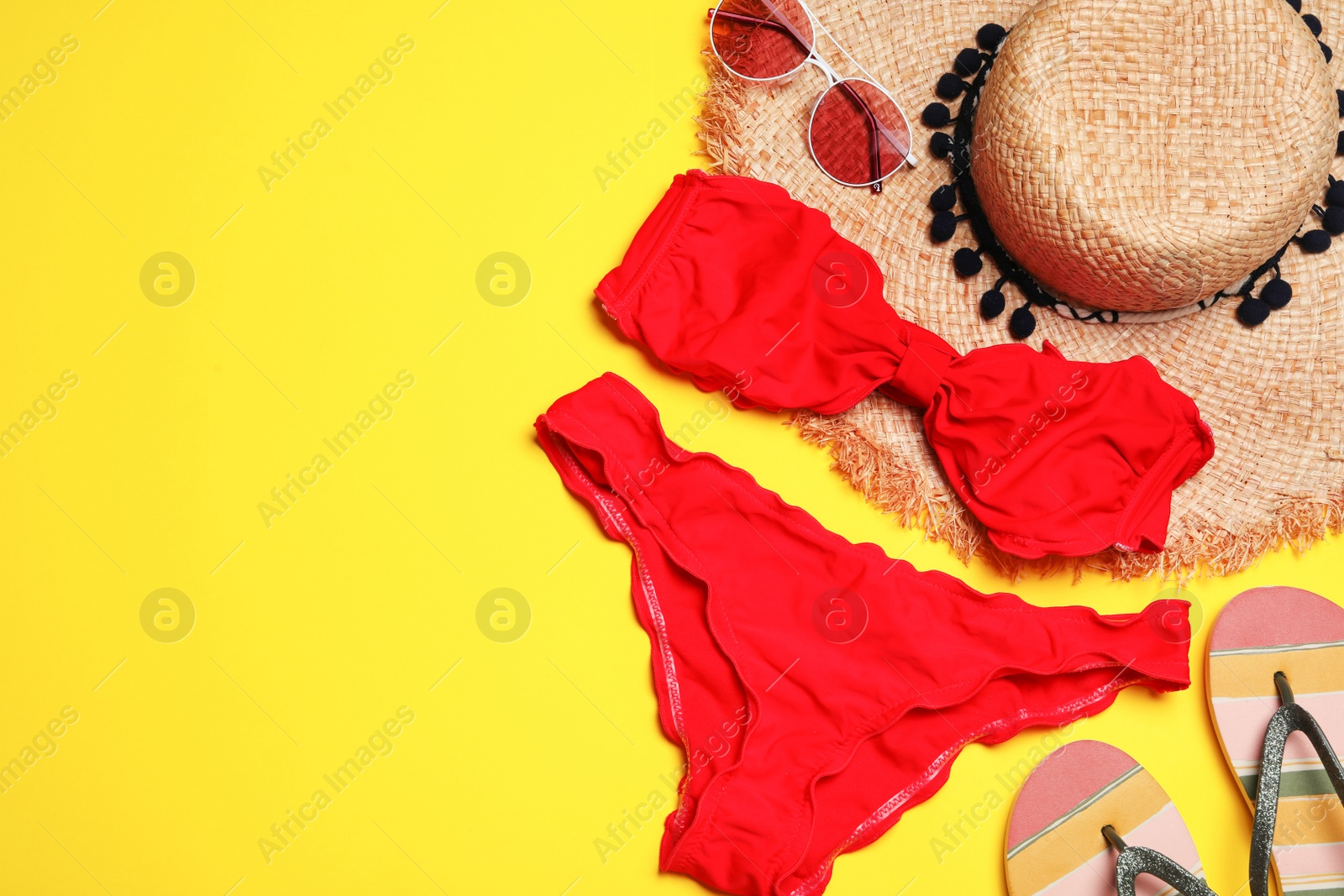 Photo of Flat lay composition with stylish bikini on color background, space for text. Beach objects