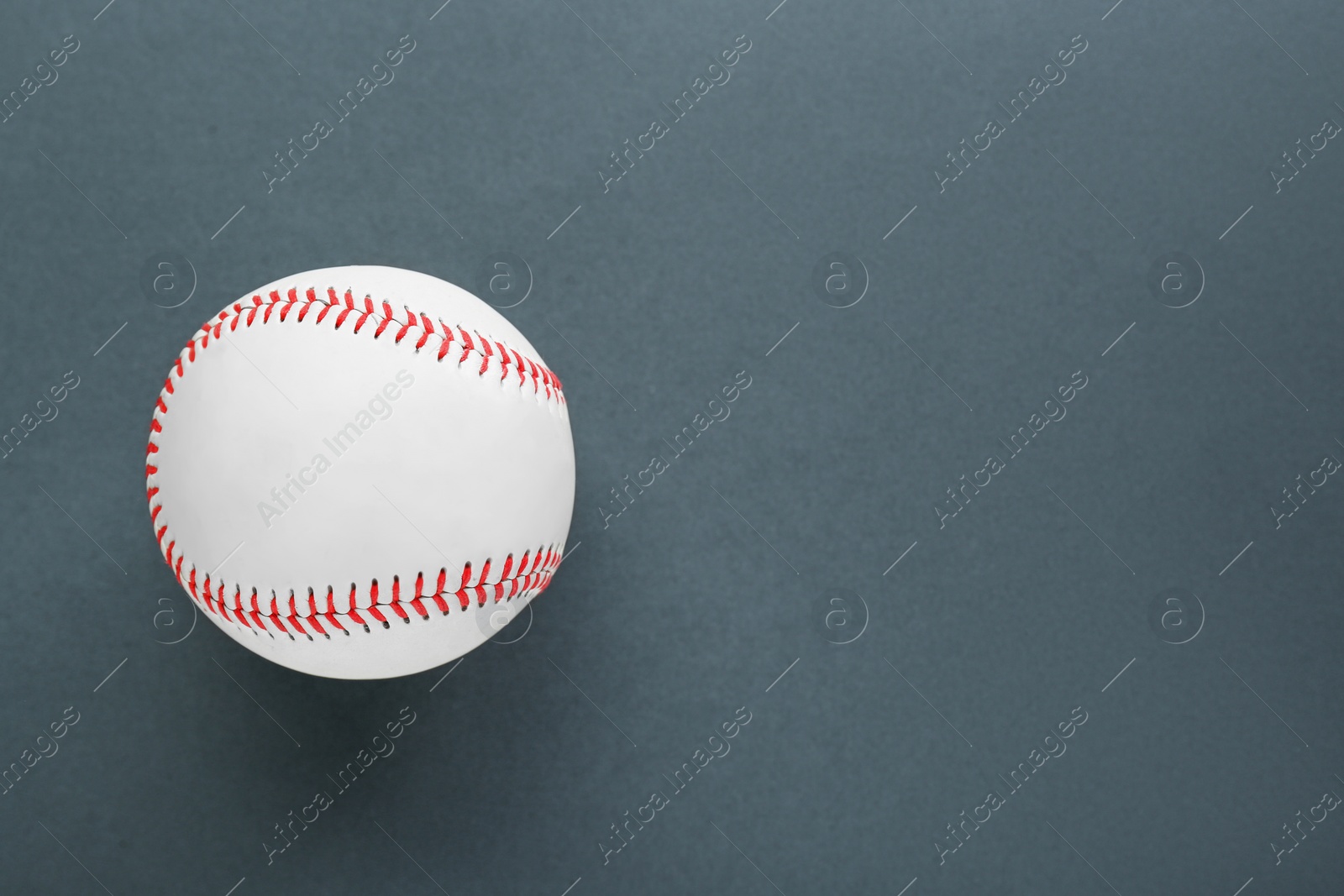 Photo of Baseball ball on dark background, top view with space for text. Sports game