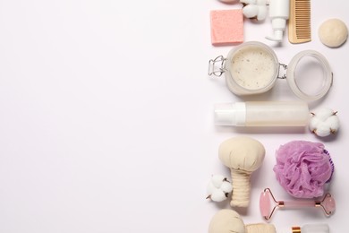 Bath accessories. Flat lay composition with personal care products on white background, space for text