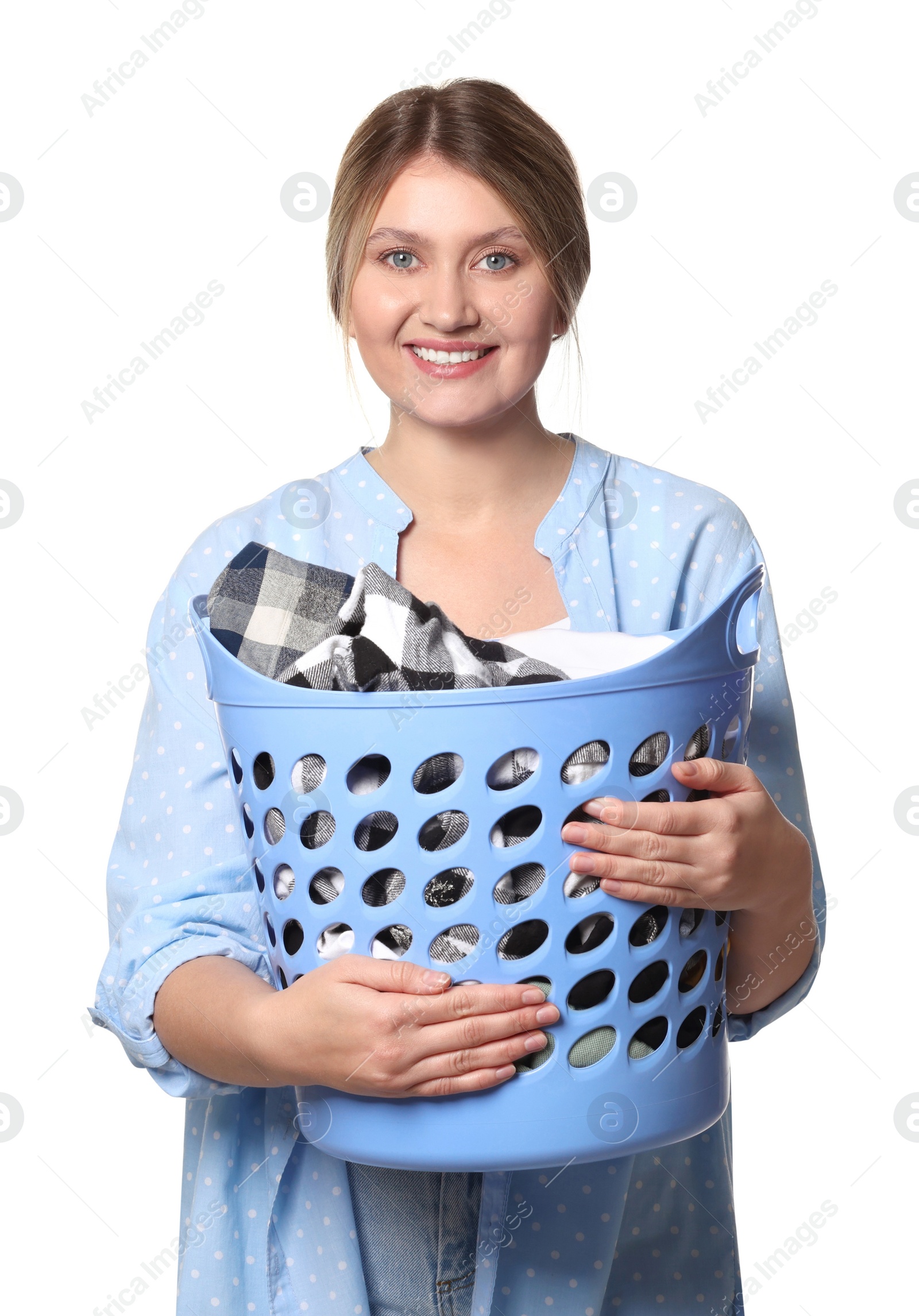 Photo of Happy woman with basket full of laundry on white background