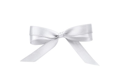 Photo of Beautiful silver ribbon tied in bow isolated on white, top view