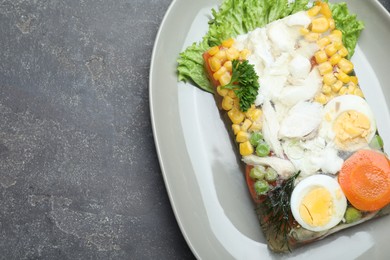 Delicious fish aspic served on grey table, top view. Space for text