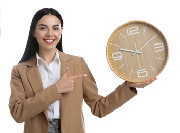 Businesswoman holding clock on white background. Time management