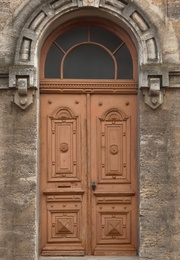 Photo of Big vintage wooden door of old building