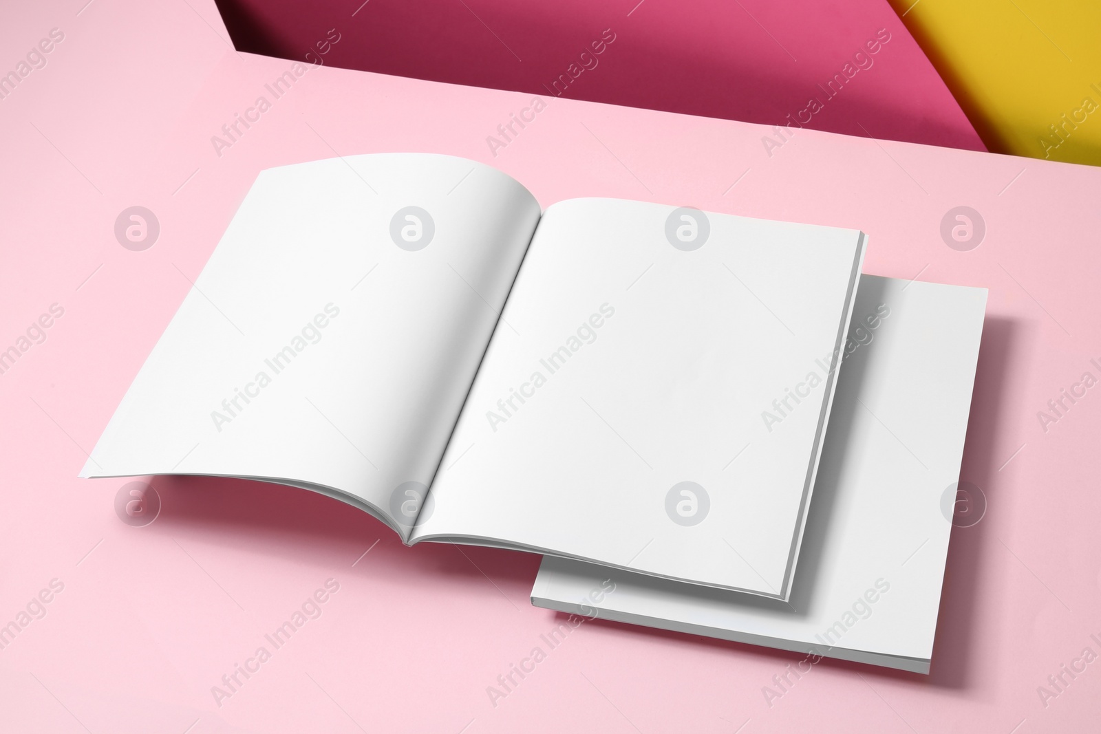 Photo of Empty book pages on color background. Mockup for design