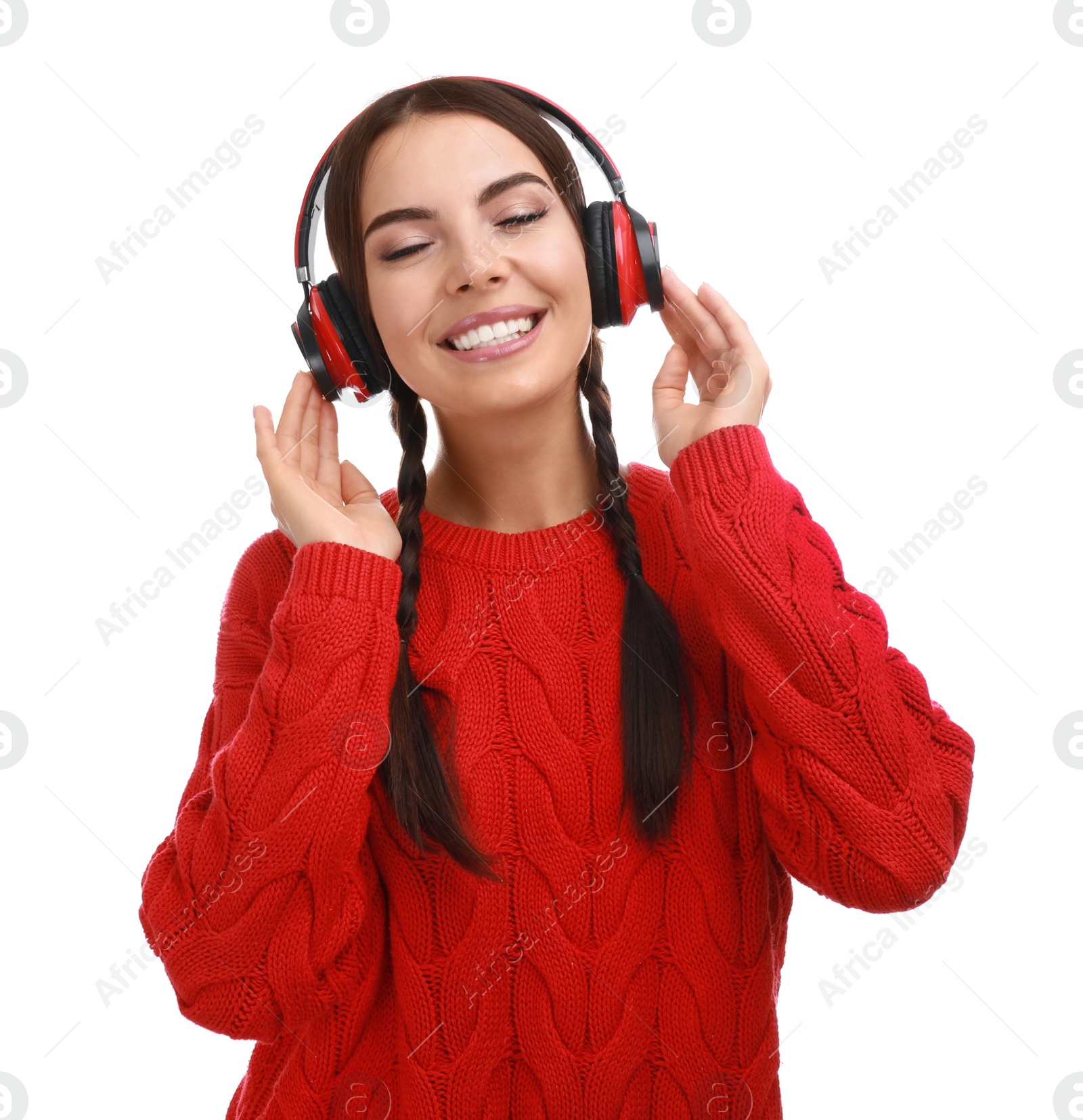 Photo of Young woman listening to music with headphones on white background