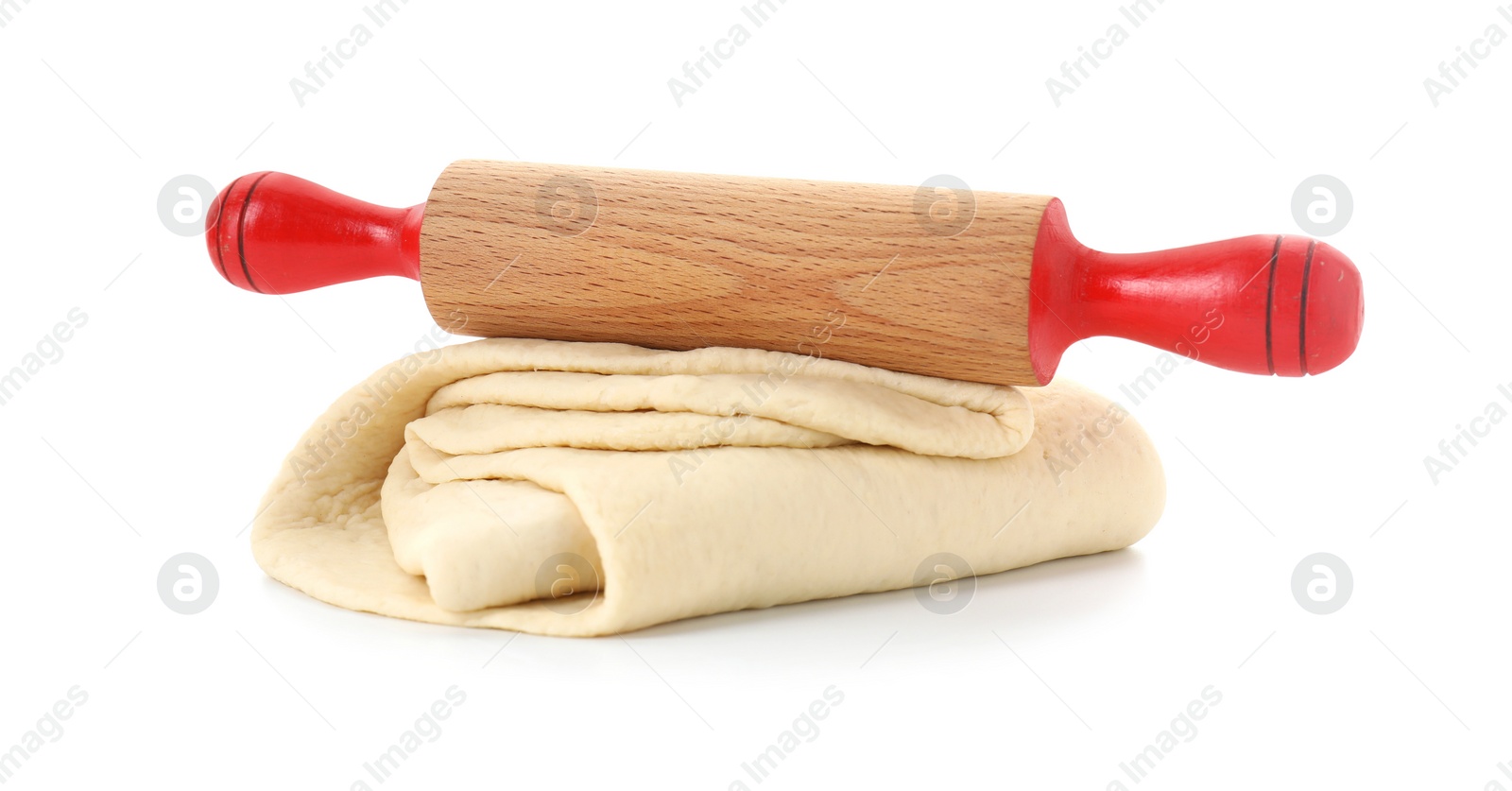 Photo of Raw dough and rolling pin isolated on white