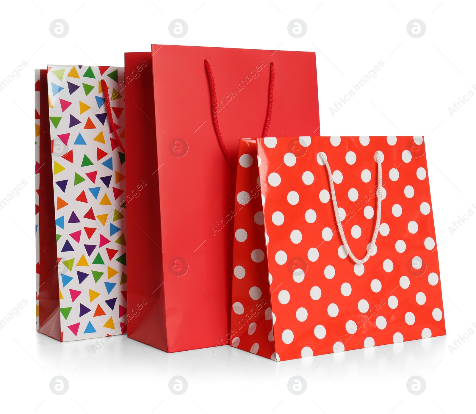 Photo of Stylish gift paper bags isolated on white