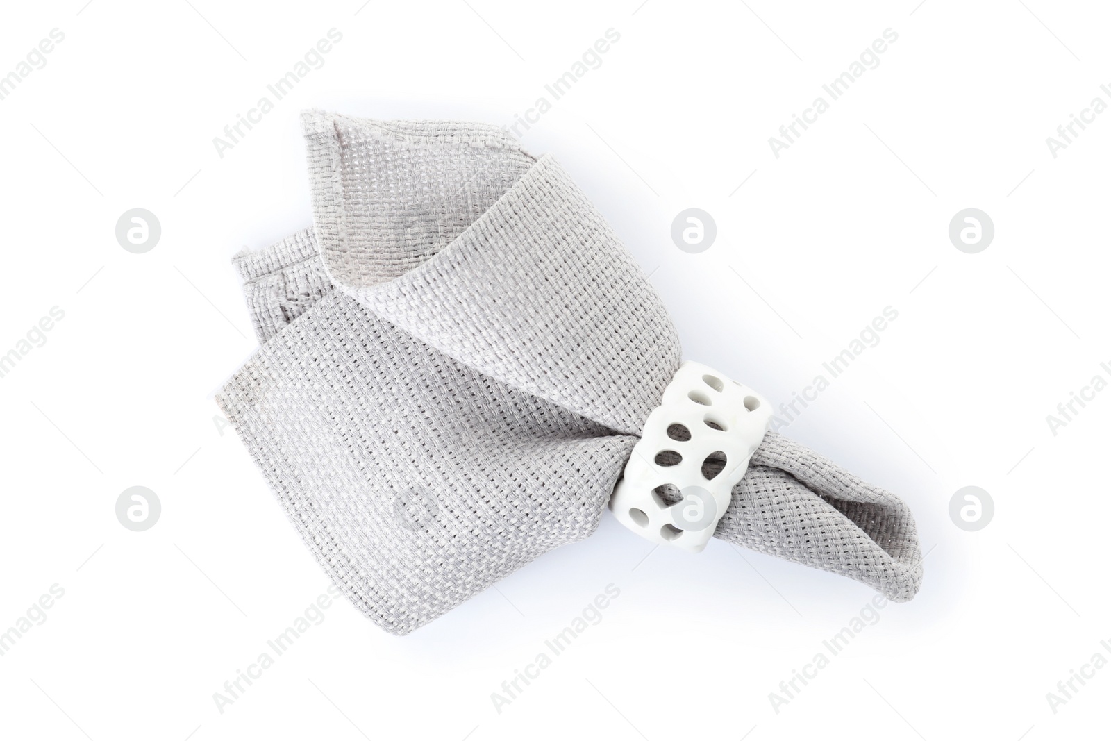 Photo of Fabric napkin with decorative ring for table setting on white background