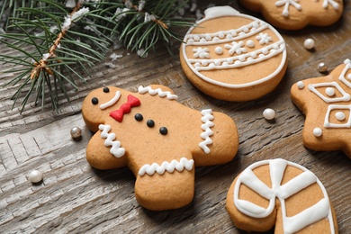 Photo of Tasty homemade Christmas cookies on wooden table, closeup view