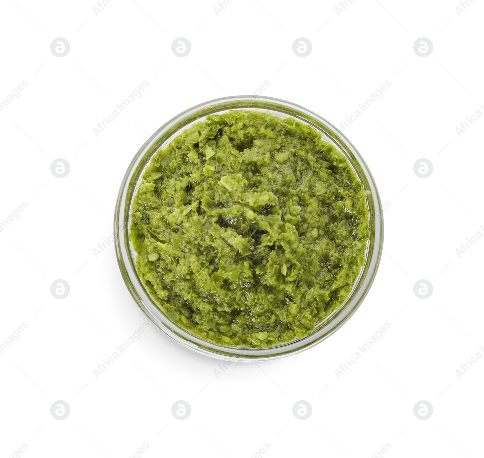 Photo of Delicious pesto sauce in bowl isolated on white, top view