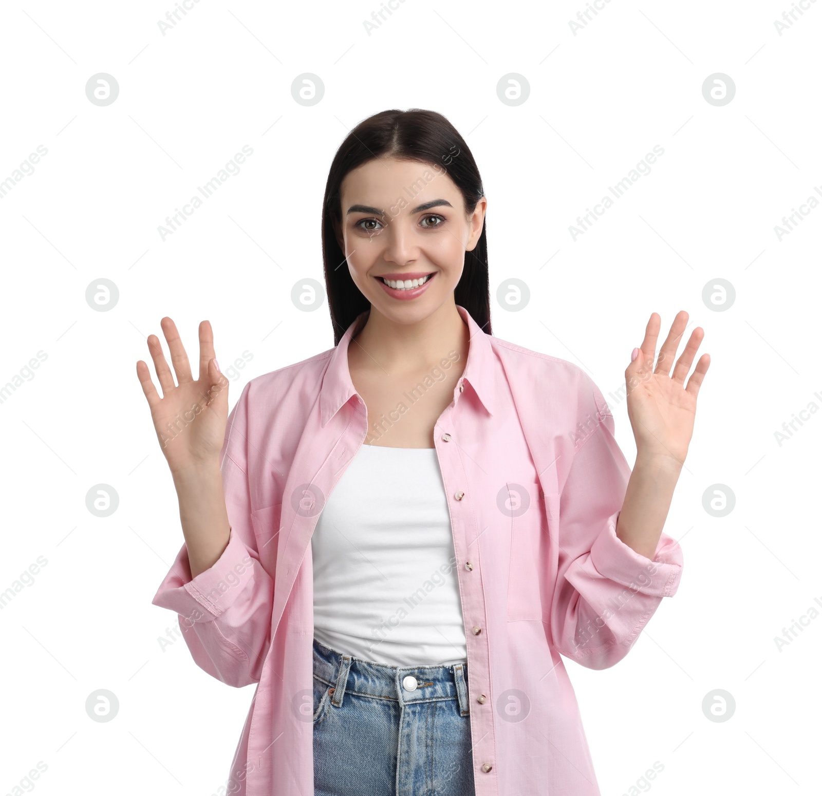 Photo of Attractive young woman showing hello gesture on white background