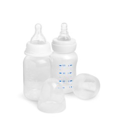 Photo of Two empty feeding bottles for infant formula on white background