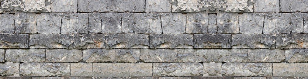 Texture of grey stone wall as background. Banner design