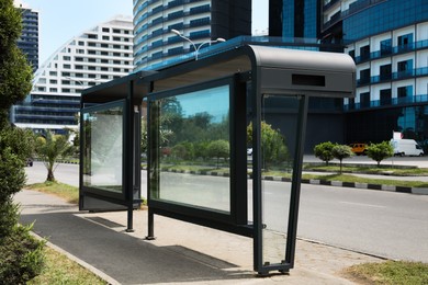 Photo of Modern public transport stop on city street