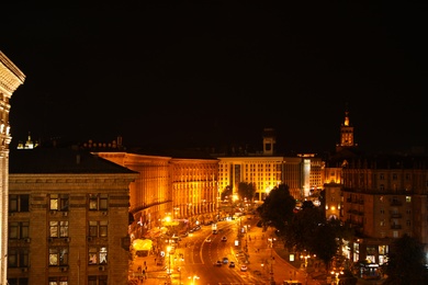 KYIV, UKRAINE - MAY 22, 2019: Beautiful view of illuminated Khreshchatyk street with buildings and road traffic