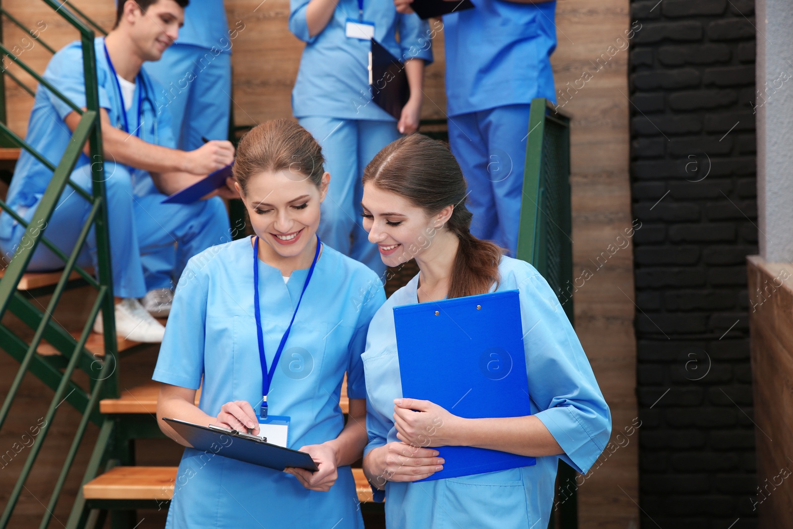 Photo of Young smiling medical students in university hall