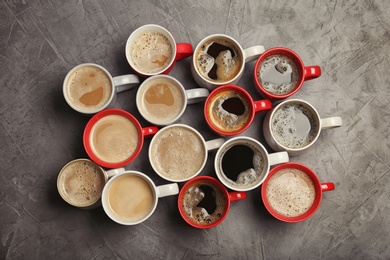 Flat lay composition with cups of coffee on grey background. Food photography