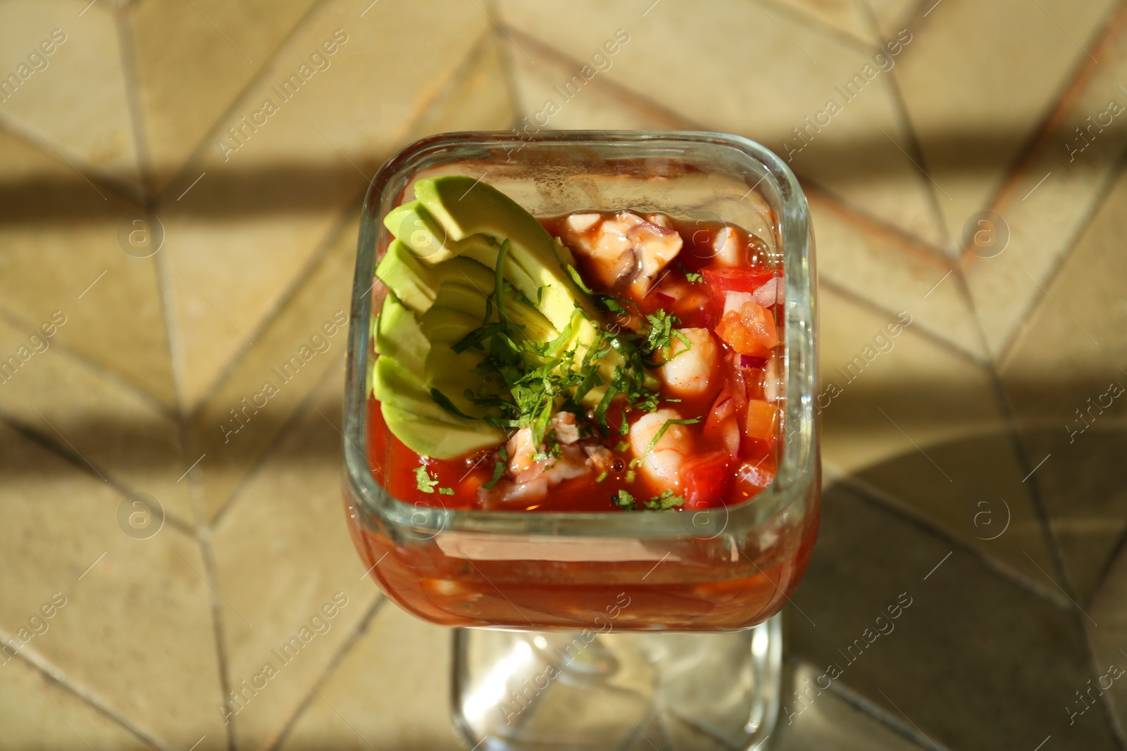 Photo of Delicious campechana cocktail on table, above view