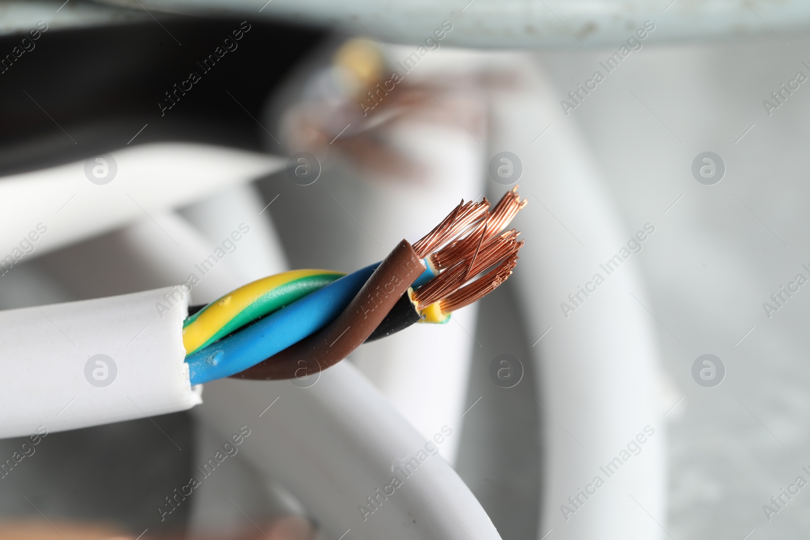 Photo of Colorful electrical wire on blurred background, closeup