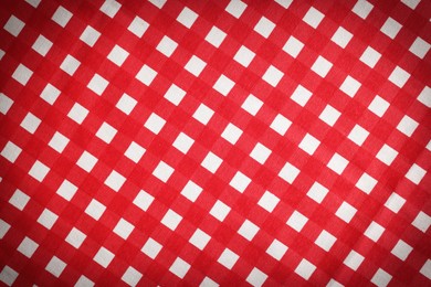 Image of Red and white tablecloth as background, vignette effect